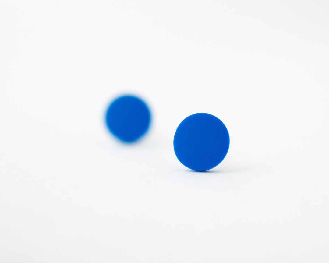blue stud earrings bokeh view