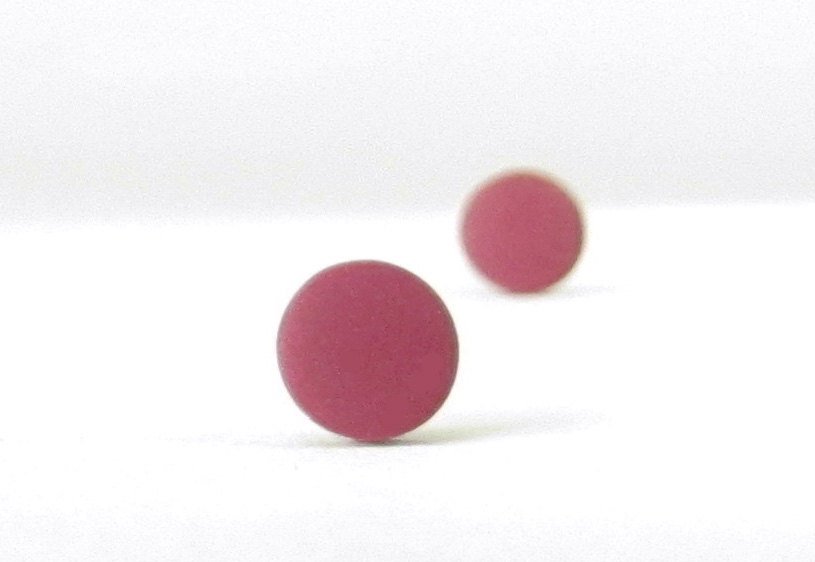burgundy stud earrings bokeh view
