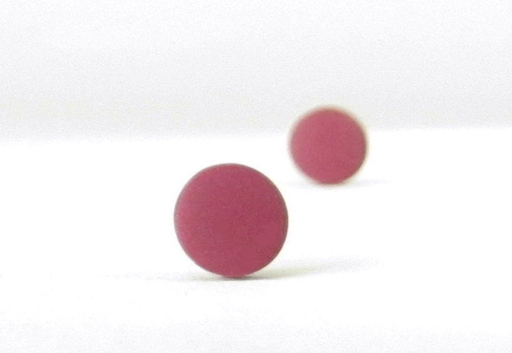 burgundy stud earrings bokeh view