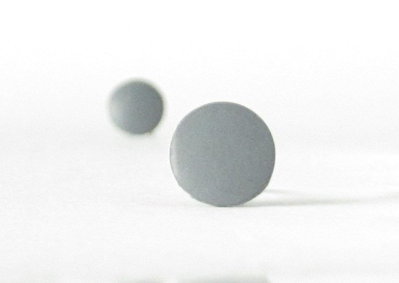 gray stud earrings bokeh view