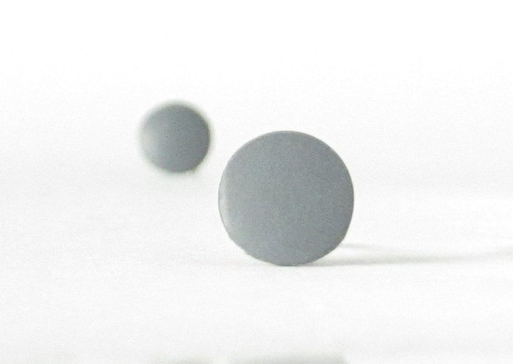 gray stud earrings bokeh view