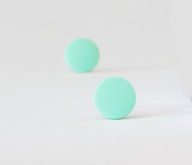 mint green stud earrings bokeh view
