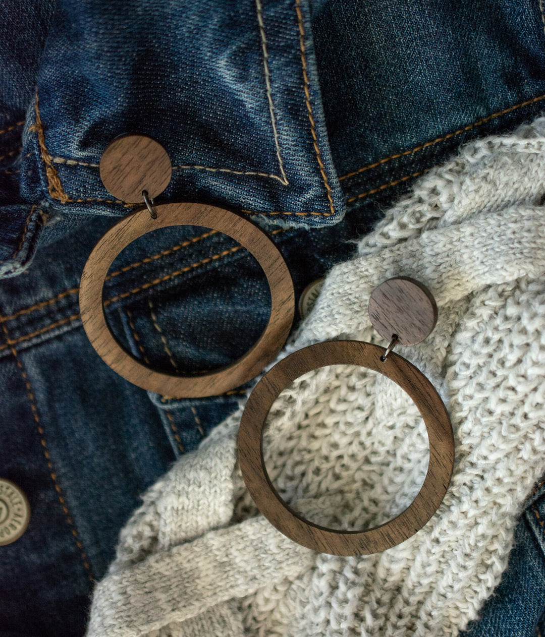 walnut hoop earrings on cream sweater and denim jacket