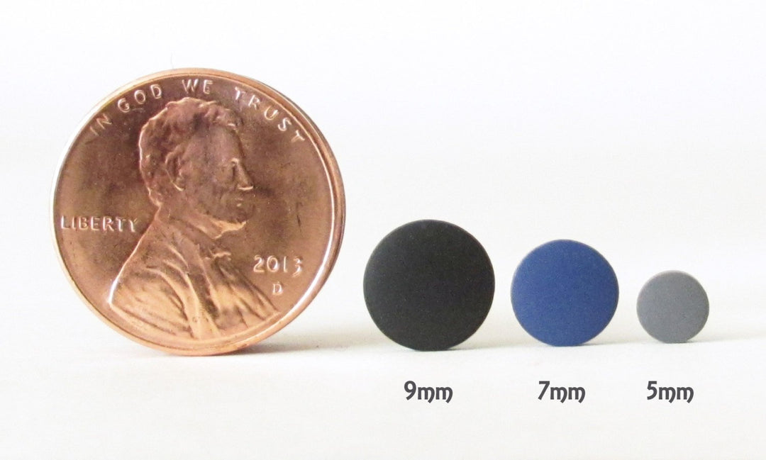 9mm, 7mm, 5mm stud earring size comparison next to penny