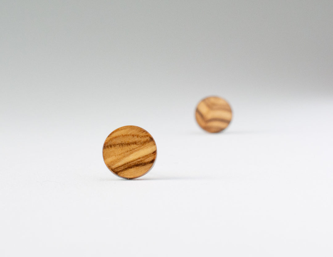 olive wood studs bokeh view