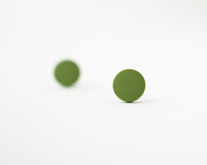 olive green studs bokeh view
