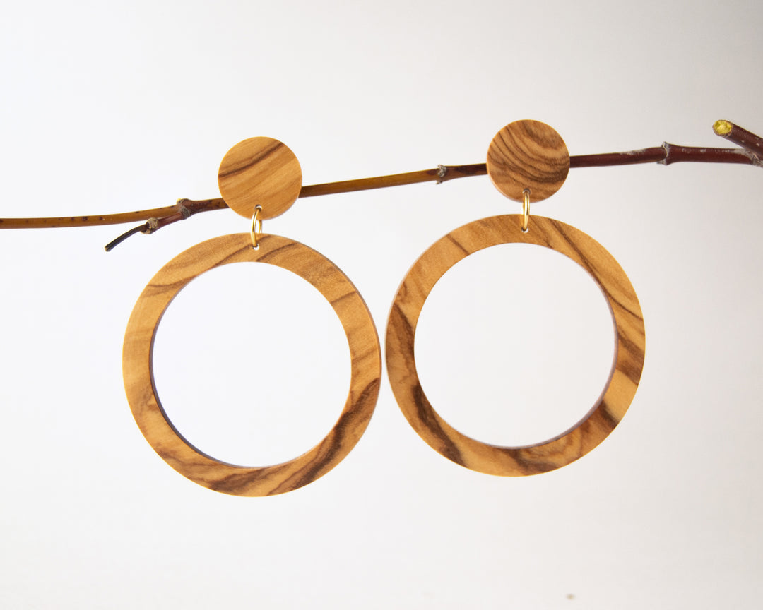 olive wood hoops hanging from twig